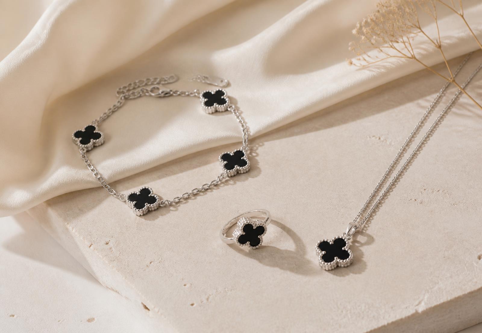 Delicate clover-motif bracelet worn on the wrist